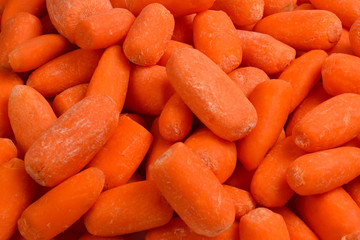 Little fresh carrots as a background. Snack.