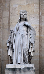 Fototapeta premium Saint Clotilde, statue on the portal of Saint Roch church in Paris, France 