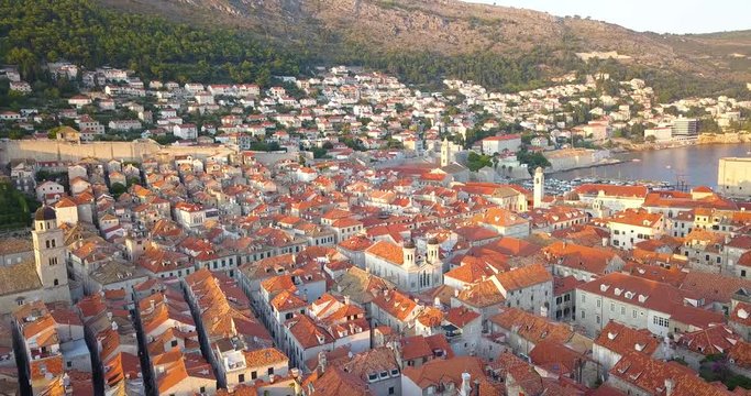 Aerial view of roofs of old town Dubrovnik Croatia. Drone flies over old roofs on sunset