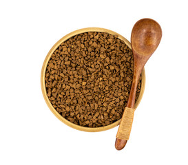Granulated coffee in a wooden mug with a spoon on a white background