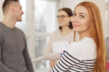 Beautiful college girl studying on campus