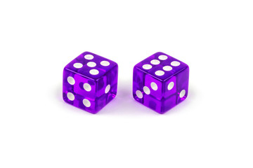 Two purple glass dice isolated on white background. Five and six.