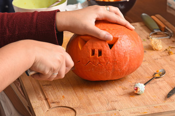 preparing a pumpkin for halloween