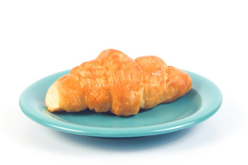 Home made fresh croissant on white background.