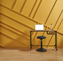 Yellow background wall with home object vase of flower computer and coffee table style.