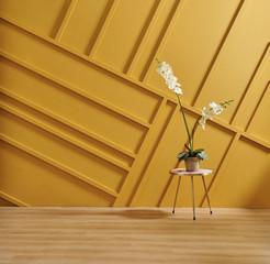 Yellow background wall with home object vase of flower computer and coffee table style.