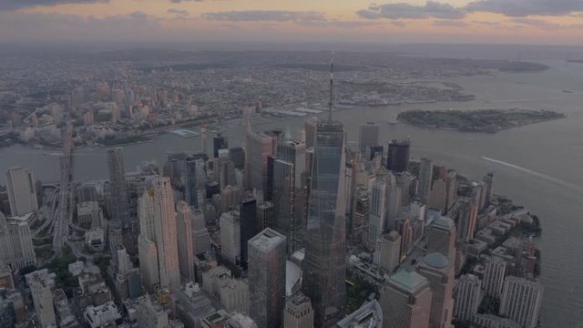 Helicopter aerial flying over downtown New York city at sunset