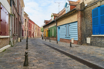 Alley with colorful houses in old town of Amiens