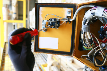 Electrical terminal in junction box and service by technician. Electrical device install in control...