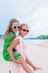 Fototapeta premium Kids have a lot of fun at tropical beach playing together