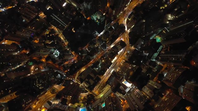 night time illuminated hong kong city traffic streets aerial topdown panorama 4k 