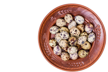 quail eggs in a plate on a white background