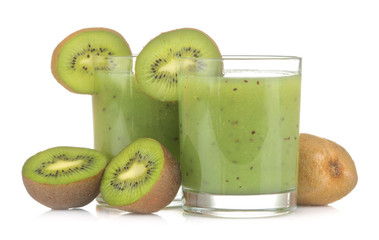 Fototapeta na wymiar Kiwi smoothies in a glass next to fresh kiwi slices on a white isolated background. fruit drink.