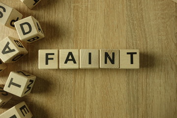 Faint word from wooden blocks on desk