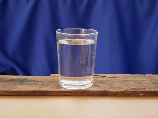 glass of water on wooden table