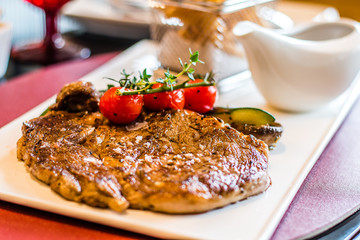 L’Entrecote de Boeuf 200 days grain fed Angus rib eye with a dense brandy cream sauce and crispy fries.