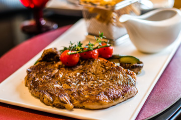 L’Entrecote de Boeuf 200 days grain fed Angus rib eye with a dense brandy cream sauce and crispy fries.