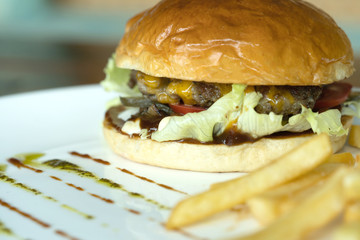 Beef burger and french fries appetizing.