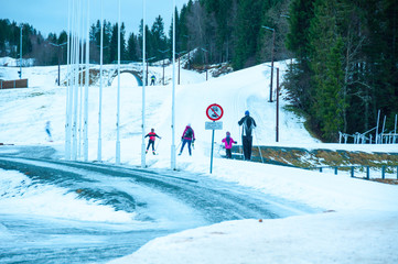 A family of skiers practices on the slopes at Granasen, near Trondheim, Norway