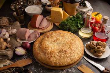 Meat pie with ham and mushrooms.