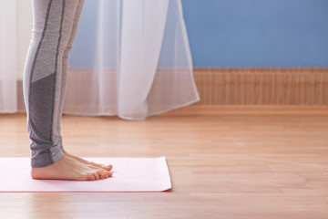 Fototapeta na wymiar Young woman doing yoga