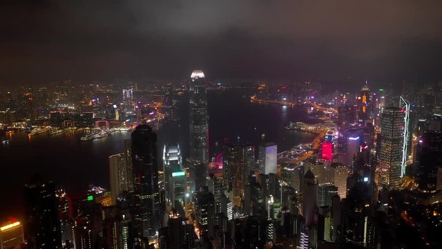 night illuminated hong kong cityscape victoria harbour bay aerial panorama 4k 