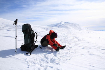 Tourist in the winter mountains