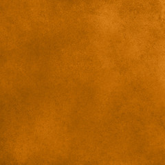 Amber color abstract grunge stucco wall background
