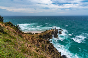 Fototapeta na wymiar Cape Byron, rocky oceanside at most easterly point of the Australian Mainland, Byron Bay, New South Wales