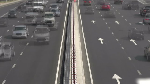 Road Traffic. Heavy traffic cars on the highway in both directions. Top view time-laps X30