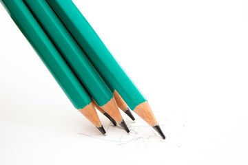 simple pencils green in the amount of five pieces on a white background