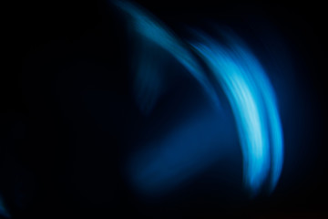 Lens Flare. Light over black background. Easy to add overlay or screen filter over photos. Abstract sun burst with digital lens flare background. Gleams rounded and hexagonal shapes, rainbow halo.