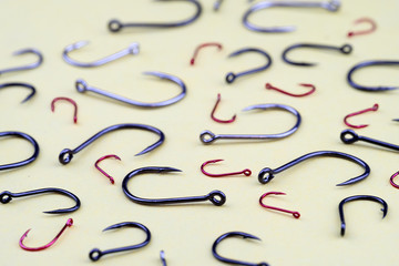 a plurality of hooks lying on the yellow surface in the future