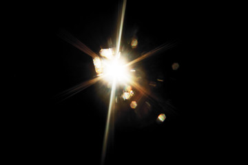 Lens Flare. Light over black background. Easy to add overlay or screen filter over photos. Abstract...