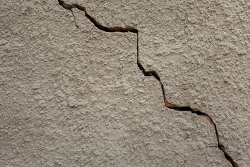 Closeup view of brick wall cracked. Horizontal color photography.
