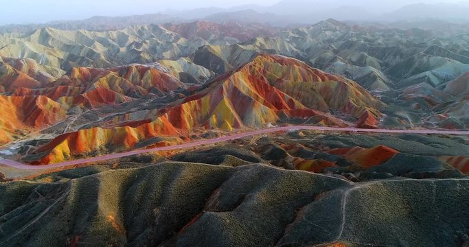 Aerial 4k drone footage of most colorful mountains on earth, the Rainbow mountains of Zhangye. Shown is the most vibrant, multicolored part of this amazing landscape located in Gansu, China. 