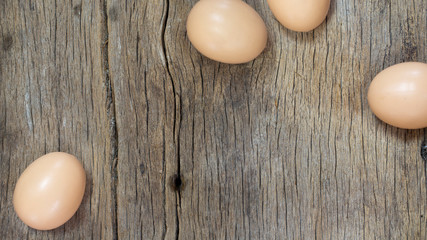 Serveral egg on wood plank, top view shooting, beautiful wooden texture.