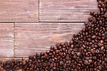Coffee beans on brown wooden table