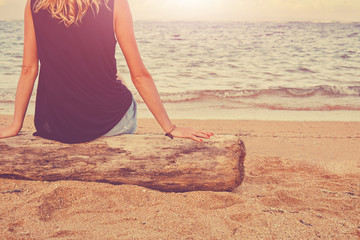 Attractive woman enjoying the view on the tropical beach.