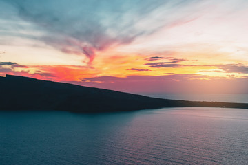 Colorful sunset above Santorini island, Oia, Greece