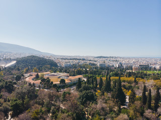 City views of day time with acropolis on a hill at the horizon, Athens, Greece
