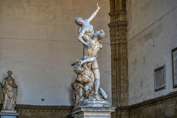 Sculpture The Rape of the Sabine Women, made by sculptor Giambologna. Loggia dei Lanzi at the Piazza della Signoria in Firenze, Italy