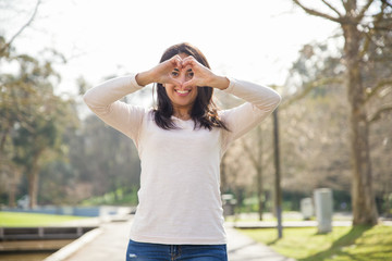 Playful positive girl expressing love