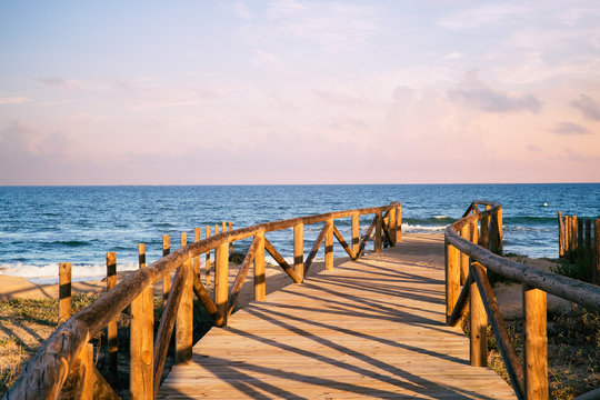 wooden access to the beach on  sand dunes