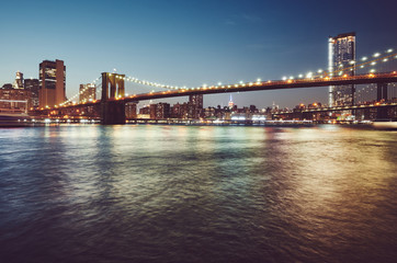 Fototapeta na wymiar Brooklyn Bridge at blue hour, color toned picture, New York City, USA.