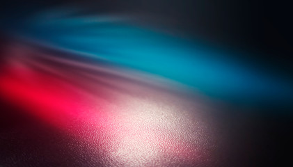 Background empty street at night. Wet asphalt, reflection of neon multi-colored light. Fog, smoke