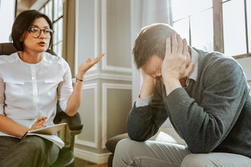 Professional female psychotherapist with bob haircut actively gesturing