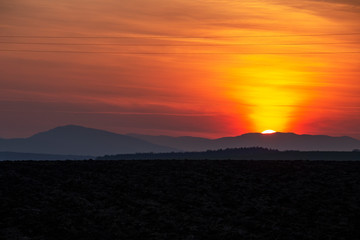Spectacular sunset over plowed agricultural field in Southern Bulgaria