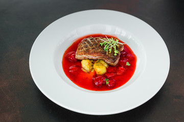 Steak  from fillet of a duck with caramelized strawberry and an eggplant
