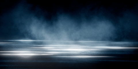 Wet asphalt, reflection of neon lights, a searchlight, smoke. Abstract light in a dark empty street with smoke, smog. Dark background scene of empty street, night view, night city.